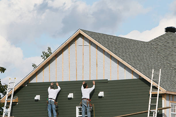 Professional Storm Damage Siding Repair technician working in Oakdale, PA